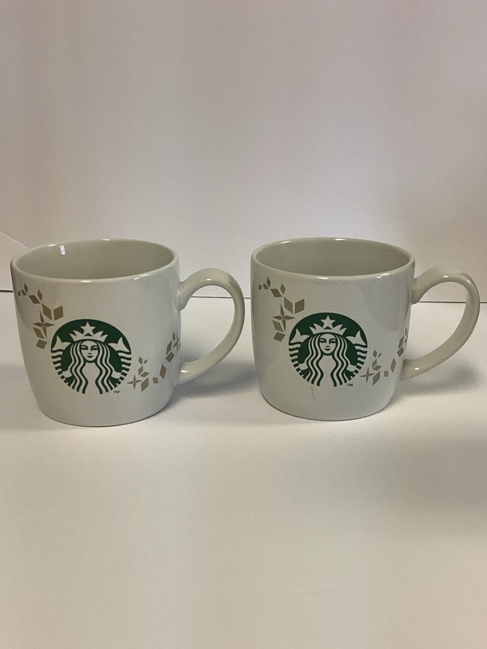 Starbucks White Ceramic Mug Pair with Green Logo and Gold Accents 14 Oz